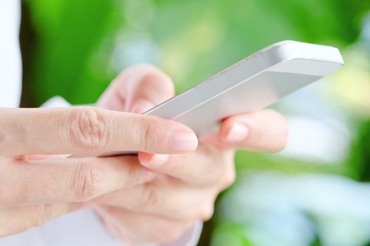 Image of Woman hand Using a Smart Phone background,communication