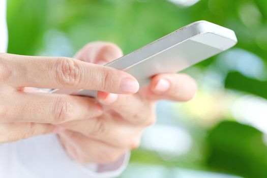 Image of Woman hand Using a Smart Phone background,communication