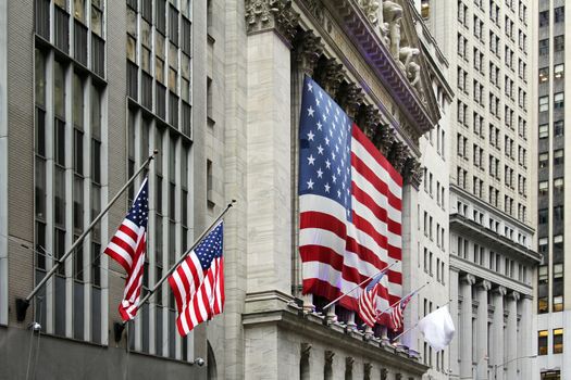 Wall Street with New York Stock Exchange in Manhattan Finance district during United States economy recovery in Manhattan. New York City.