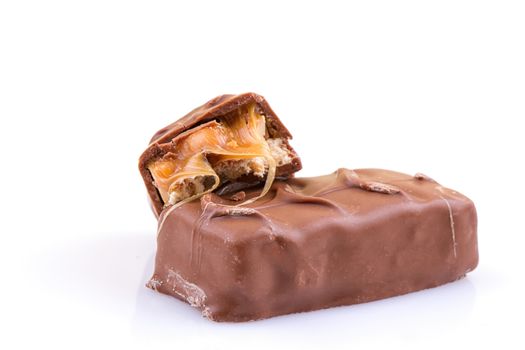 Chocolate bar with caramel isolated on white