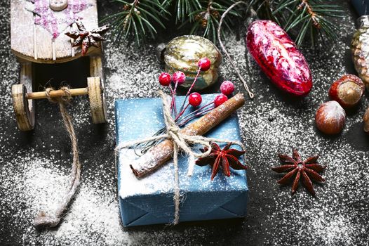 Box with Christmas present and Santa Claus's sledge