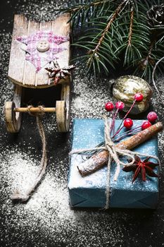 Box with Christmas present and Santa Claus's sledge
