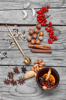 glass of mulled wine and spice rack for beverage