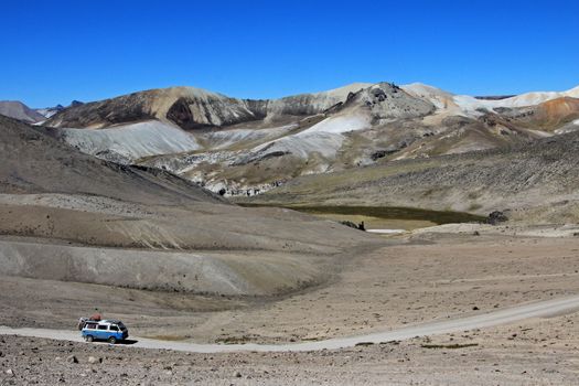 Van cruising an abondend road in the peruvian andes mountains in a very nice moon valley