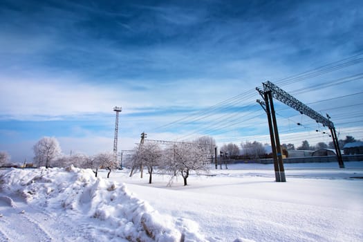 Railway station in winter. Snow-covered urban scene in Belarus