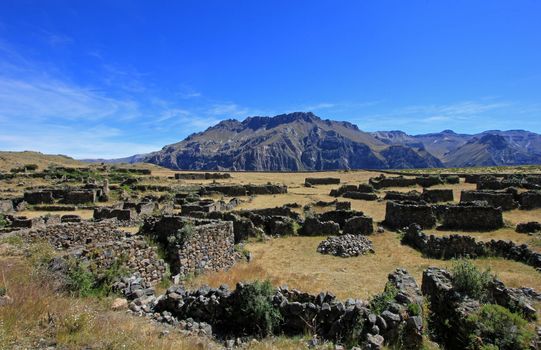 The pre-inca ruins of Maukallacta on the mountain over Puica a peruvian mountain village over the cliffs of the beautiful Cotahuasi Canyon