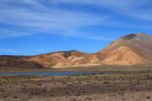 The colorful mountains and a nice lake in the peruvian andes on the way to Colca canyon