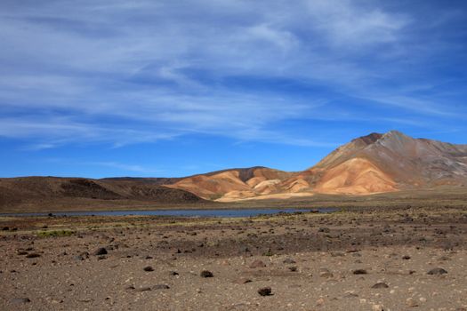 The colorful mountains and a nice lake in the peruvian andes on the way to Colca canyon