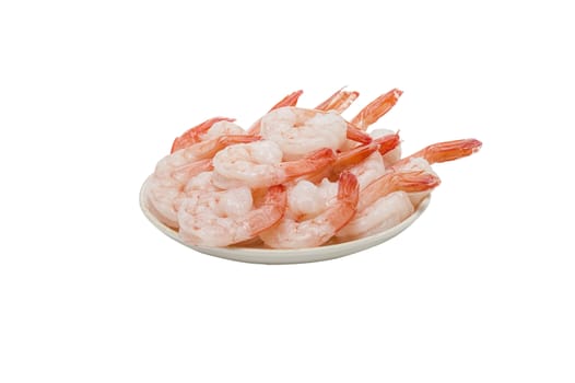 Red peeled prawns lie on a saucer isolated on white background