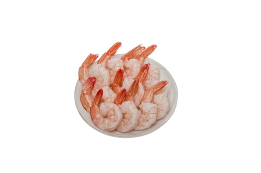 Red peeled prawns lie on a saucer isolated on white background