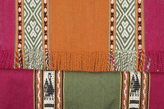 Details shot of wool fabric with colorful pattern, inca indian pattern.
