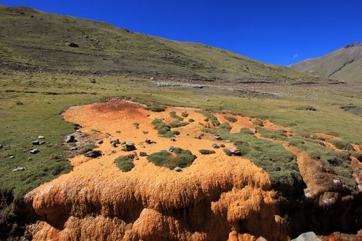 Nice orange sulfur stream in the andean mountains of Peru
