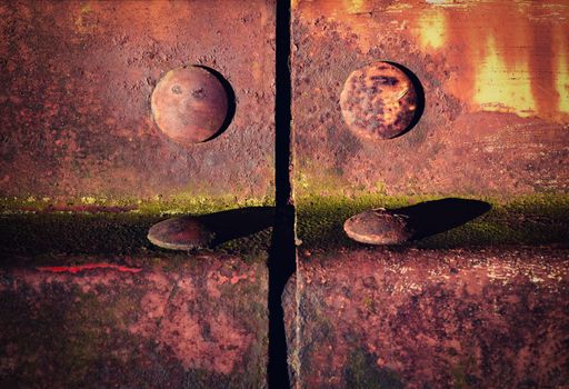 background or texture detail of an old iron fencing riveted joints