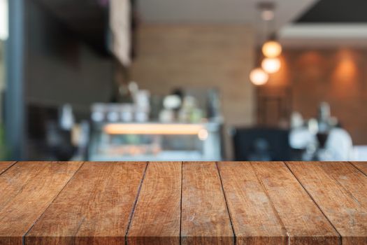 Perspective top brown wooden with blurred coffee shop. product display template