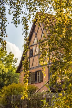 Traditional german house, swabian region specific, sawn through the hanging birch tree branches