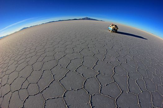 Van on Salar de Uyuni, salt lake, is largest salt flat in the world, altiplano, Bolivia, South America, fisheye perspective