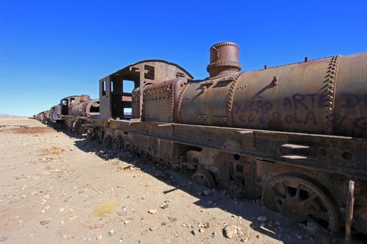 Graveyard of rusty old trains in the desert of Uyuni, Bolivia