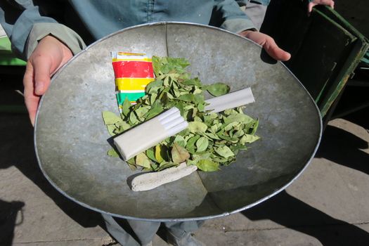 Gifts for miners, presented in bowl, coca leaves and dynamite, Potosi, Bolivia