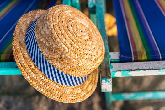 Woven hat on the beach chair