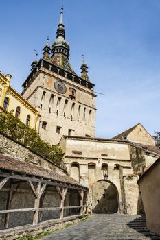 View to the watch tower and architecture in Sighisoara town, Romania