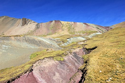 Along the hike up to the Rainbow Mountain near Cusco Peru. Not less colorful. Located about 20km south of Ausangate mountain.