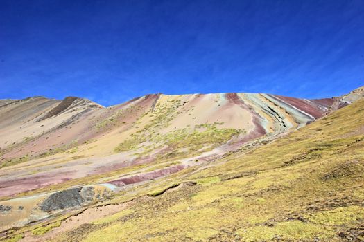 Along the hike up to the Rainbow Mountain near Cusco Peru. Not less colorful. Located about 20km south of Ausangate mountain.