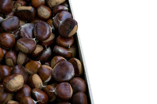 Raw chestnuts group on a white background