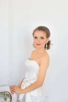 Portrait of a girl in a white dress close-up