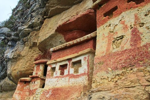 Pre inca mausoleum Revash in the mountains of northern Peru. Famous for the built in the wall and for the colorfull red and brown paintings.