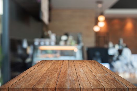 Perspective top wooden with blurred coffee shop. product display template