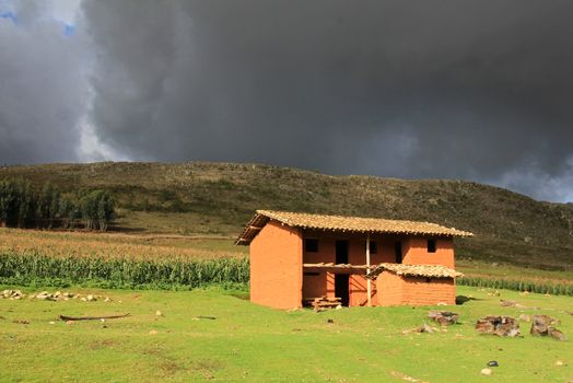 Nice adobe brick house northern Peru. Nice evening light and clouds.