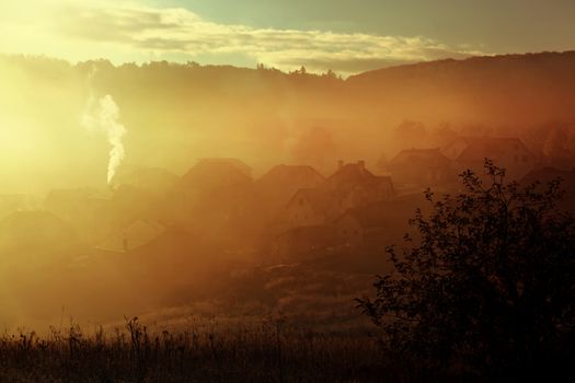 sunrise with fog over countryside at autumn