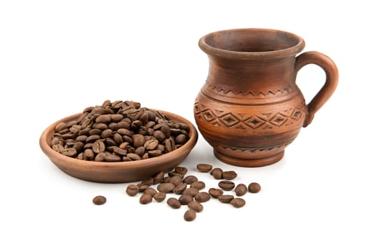 pottery and coffee beans isolated on white background