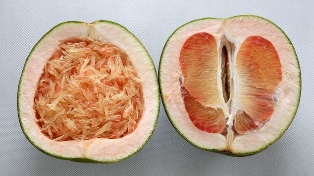 Grapefruit on white background, tropical fruit, Vietnamese agriculture product, rich vitamin A, healthy eating, reduce cholesterol, prevent kidney stones, oxidation, anti cancer, make lose weight