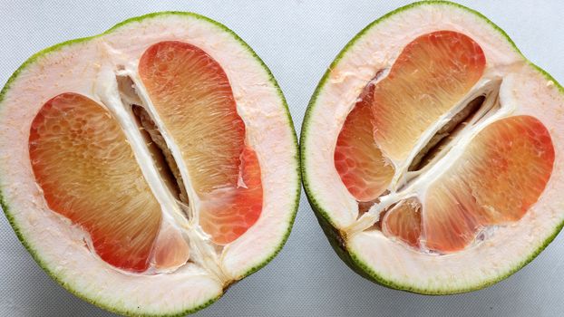 Grapefruit on white background, tropical fruit, Vietnamese agriculture product, rich vitamin A, healthy eating, reduce cholesterol, prevent kidney stones, oxidation, anti cancer, make lose weight