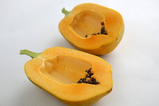 Papaya on white background, tropical fruit, Vietnamese agriculture product, rich fiber and vitamin A,C ,E, make healthy heart, prevent atherosclerosis, laxative, good for digestive system, tonic