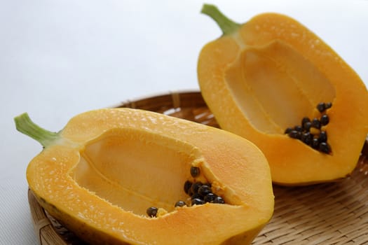 Papaya on white background, tropical fruit, Vietnamese agriculture product, rich fiber and vitamin A,C ,E, make healthy heart, prevent atherosclerosis, laxative, good for digestive system, tonic