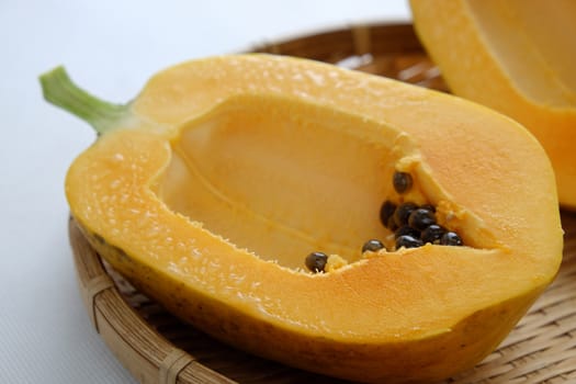 Papaya on white background, tropical fruit, Vietnamese agriculture product, rich fiber and vitamin A,C ,E, make healthy heart, prevent atherosclerosis, laxative, good for digestive system, tonic