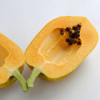 Papaya on white background, tropical fruit, Vietnamese agriculture product, rich fiber and vitamin A,C ,E, make healthy heart, prevent atherosclerosis, laxative, good for digestive system, tonic