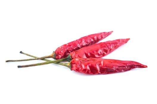 Dried red chili peppers isolated on white background. Food ingredient for spicy cooking.