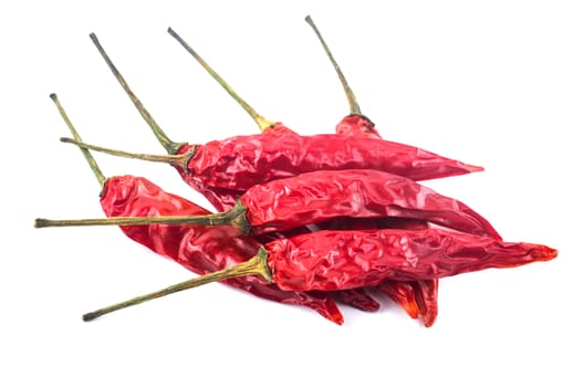 Dried red chili peppers isolated on white background. Food ingredient for spicy cooking.