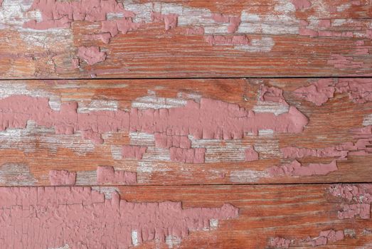 texture of wooden surface with remnants of old paint that has dried and cracked under the influence of weather