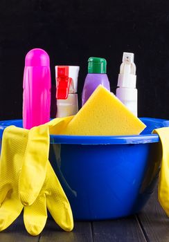 Cleaning items in bucket isolated on black