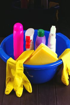 Cleaning items in bucket isolated on black