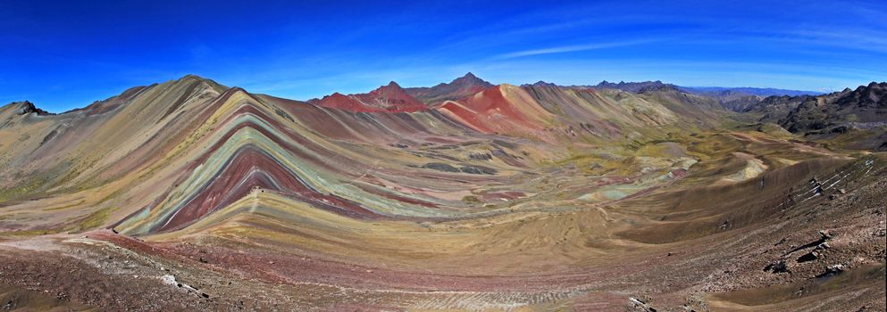 The total panorama of the beautiful colored Rainbow Mountain, near Cusco in the peruvian mountains. Located about 20km south of Ausangate mountain.