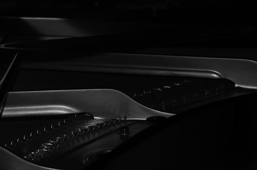 Black-and-white images of parts of the piano inside. Horizontal photo. Anyone