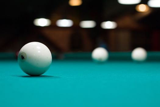 Russian billiard in club, balls on green table cloth