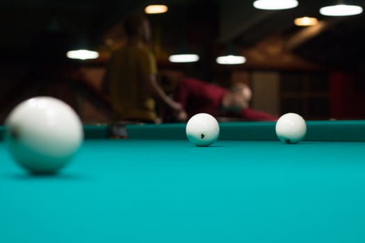 Russian billiard in club: ball, on green game table