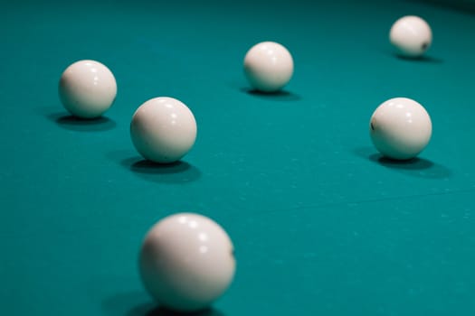 Close-up of Russian billiards, balls on green game table