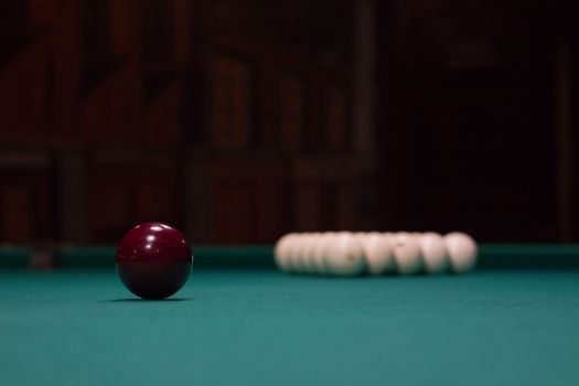 Russian billiards,  red and white balls on green table cloth